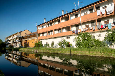 Cycling lane along the Naviglio Pavese, from Pavia to Milan (Lombardy, Italy) in the springtime. Buildingsの写真素材