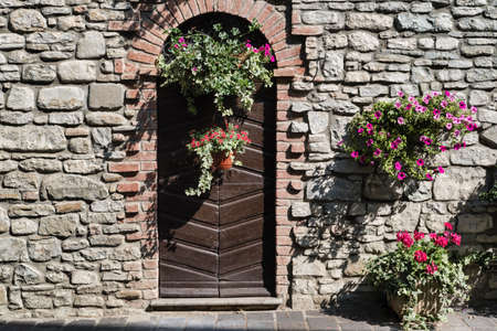 Nibbiano (Piacenza, Emilia-Romagna, Italy): old typical house exterior with plants and flowersの写真素材