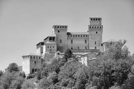 The medieval castle of Torrechiara (Parma, Emilia Romagna, Italy) at summer. Black and white