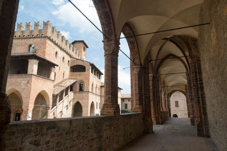 Castell'Arquato (Piacenza, Emilia Romagna, Italy), Palazzo del Podestà seen from the portico of the historic Santa Maria churchの写真素材