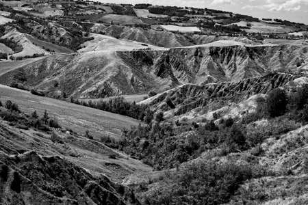 Summer landscape near Rivalta di Lesignano de Bagni (Parma, Emilia-Romagna, Italy), with the typical rocky inlets. Black and whiteの写真素材