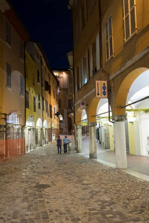 Cesena (Emilia Romagna, Italy): old street with portico at evening