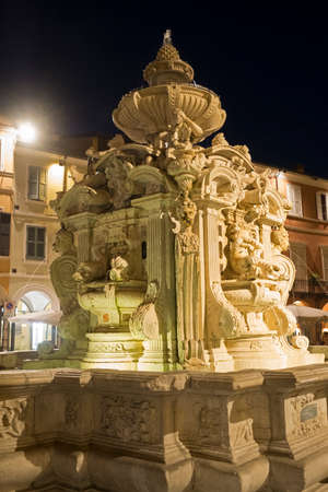 Cesena (Emilia Romagna, Italy): the monumental fountain in the main square of the city at eveningの写真素材