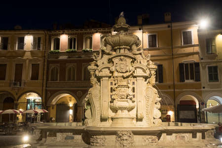 Cesena (Emilia Romagna, Italy): the monumental fountain in the main square of the city at eveningの写真素材
