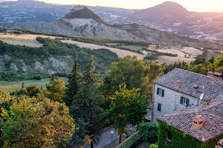 Sunset at San Leo (Forli Cesena, Emilia Romagna, Italy): landscape from the historic town at eveningの写真素材