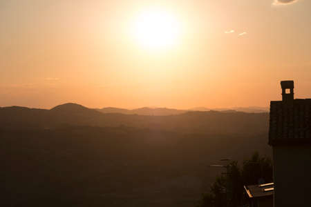 Sunset at San Leo (Forli Cesena, Emilia Romagna, Italy): the historic town at eveningの写真素材