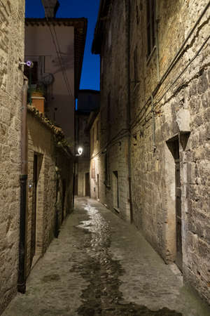 Ascoli Piceno (Marches, Italy): a very narrow alley at eveningの写真素材