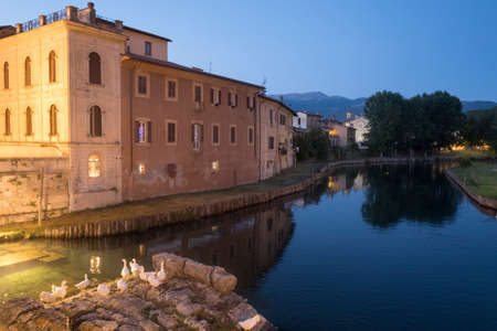 Rieti (Lazio, Italy): historic buildings along the Velino river at eveningのeditorial素材