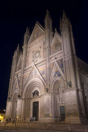 Orvieto (Terni, Umbria, Italy): facade of the historic cathedral, or Duomo, illuminated by nightのeditorial素材