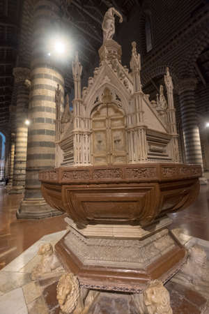 Orvieto (Terni, Umbria, Italy): interior of the historic cathedral, or Duomo, by night. Holy water fontのeditorial素材