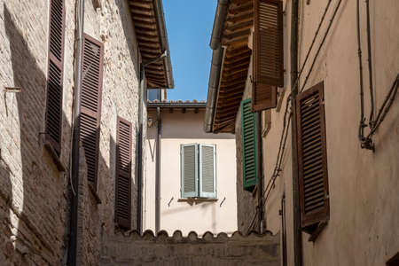 Historic buildings of Foligno, Perugia, Umbria, Italy. Old typical street in the medieval quarterの写真素材