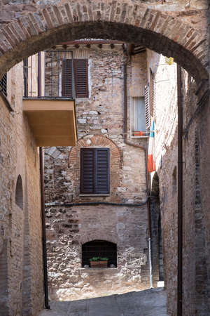 Historic buildings of Spello, medieval city (Perugia, Umbria, Italy). Alleyの写真素材