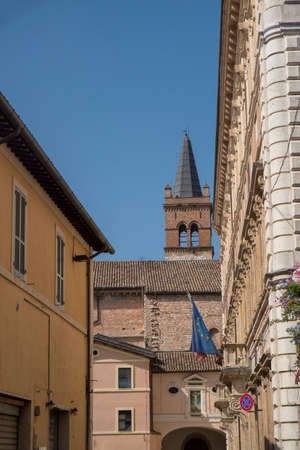 Historic buildings of Foligno, Perugia, Umbria, Italy. Old typical street and belfryの写真素材