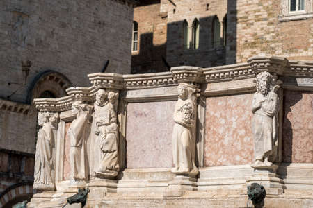 Historic buildings of Perugia, Umbria, Italy, at morning. Fountainの写真素材