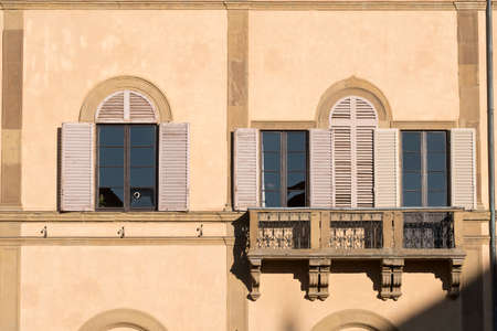 Historic buildings in SIena, Tuscany, Italy, at evening: exterior of a palace near the cathedralの写真素材