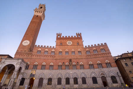 Historic buildings in Piazza del Campo in SIena, Tuscany, Italy, the famous square hosting the Palio, at eveningのeditorial素材