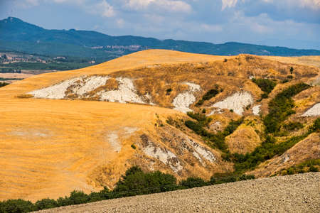 Country landscape along the road from Asciano to Siena, Tuscany, Italy, at summerの写真素材