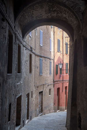 Historic buildings in SIena, Tuscany, Italy, at evening. Typical streetの写真素材