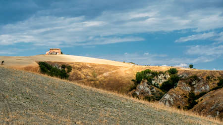 Country landscape along the road from Asciano to Torre a Castello, Siena, Tuscany, Italy, at summerの写真素材