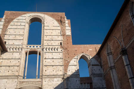 Historic buildings in SIena, Tuscany, Italy, at evening: exterior of a palace near the cathedralのeditorial素材