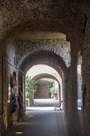 Castellina in Chianti, Siena, Tuscany, Italy: covered street in the medieval townの写真素材