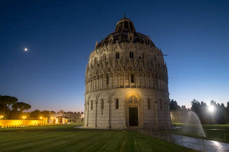 Pisa, Tuscany, Italy: the famous Piazza dei Miracoli, with the cathedral, the baptistery and the leaning tower at eveningの写真素材