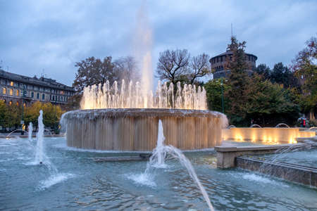 Milan, Lombardy, Italy: the castle known as Castello Sforzesco and the fountain at eveningのeditorial素材