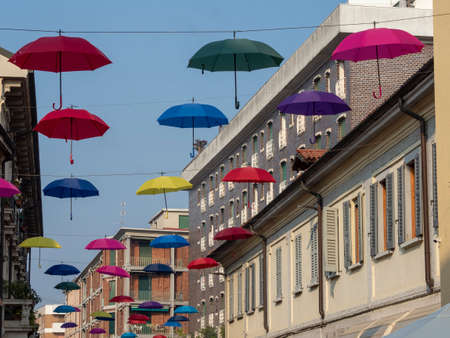 Villasanta, Monza, Brianza, Lombardy, Italy: hanged colorful umbrellas along the main streetの写真素材
