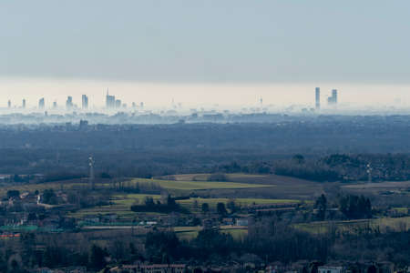 Montevecchia, Lecco, Brianza, Lombardy, Italy: panoramic view of Milan and its skyscrapersの写真素材