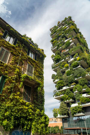 Bosco Verticale, modern towers with plants, and old typical house in Milan, Lombardy, Italyのeditorial素材