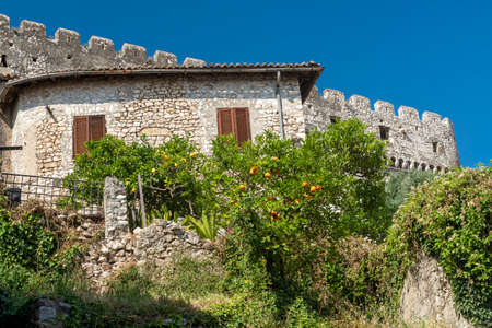 Sermoneta, Latina, Lazio, Italy: typical buildings of the historic town with orange and lemon treesの写真素材