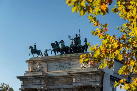 Milan, Lombardy, Italy: statues of the Arco della Pace at fallの写真素材