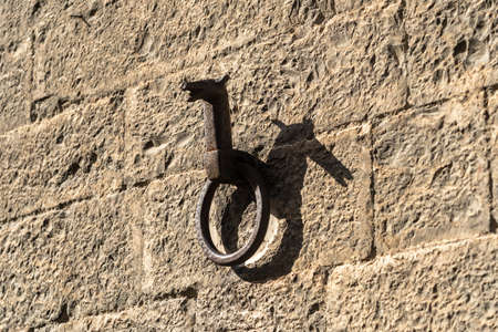 Gubbio, Perugia, Umbria, Italy: historic buildings of the medieval city. Iron ring for horses