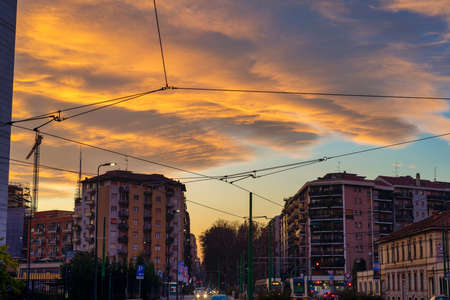 Milan, Lombardy, Italy: sunset along via Cenisio at fallの写真素材