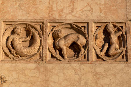 Exterior of the medieval cathedral (Duomo) of Parma, Emilia-Romagna, Italy. Detail of facadeの写真素材