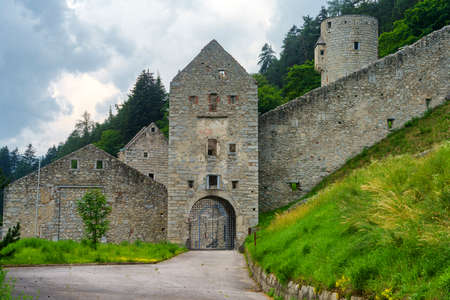 Cycleway of Pusteria Valley, Bolzano province, Trentino Alto Adige, Italy. Ruins of castle of Chiusa di Rio Pusteriaの写真素材