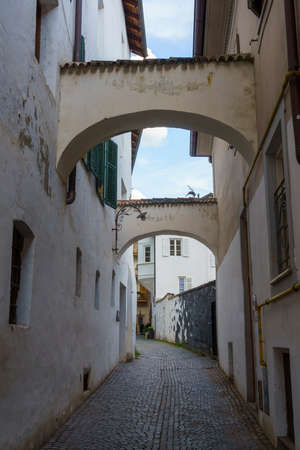 Historic city of Merano, Bolzano, Trentino Alto Adige, Italy. A street with archesの写真素材