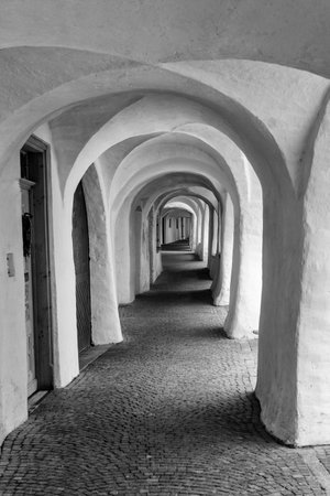 Glorenza, or Glurns, Bolzano, Trentino Alto Adige, Italy: historic city in the Venosta valley. White porch. Black and whiteの写真素材