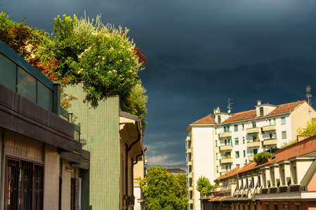 Milan, Lombardy, Italy: residential buildings along via Piero della Francesca with a storm comingの写真素材