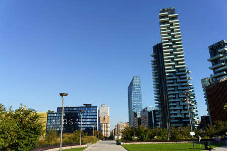 Milan, Lombardy, Italy: Torre Solaria, the highest residential building in Italy, and other modern buildings seen from Biblioteca degli Alberi parkの写真素材