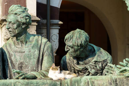 Milan, Lombardy, Italy: historic cemetery known as Cimitero Monumentale: a tomb with statues and a...