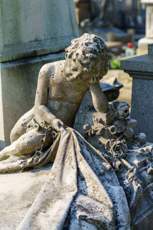 Milan, Lombardy, Italy: historic cemetery known as Cimitero Monumentale: a tomb with statueの写真素材