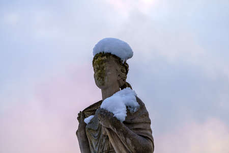 Milan, Italy: the modern Citylife park with snow. The fountain of Four Seasons, a statueの写真素材
