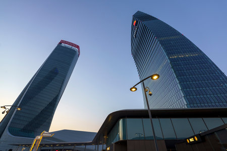 Milan, Italy: modern Citylife park with Libeskind and Hadid towers at sunsetのeditorial素材