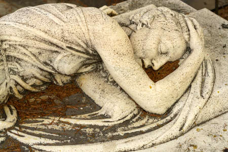 Milan, Lombardy, Italy: historic cemetery known as Cimitero Monumentale: a tomb with statueのeditorial素材