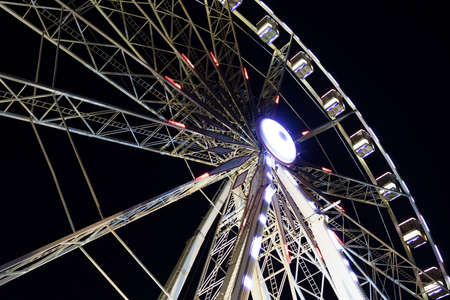 Rimini, Emilia-Romagna, Italy: the big wheel illuminated by night at the harborの写真素材