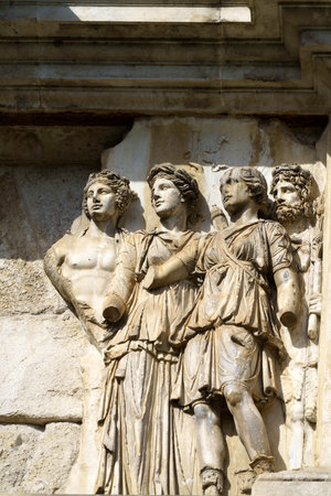 Benevento, Campania, Italy: the Roman Arco di Traiano, historic monument with sculptures, at morningの写真素材