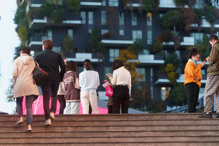 Milan, Lombardy, Italy: people at Porta Nuova, with Bosco Verticale in the backgroundのeditorial素材