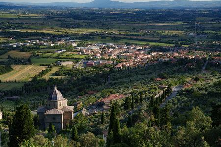 Panoramic view from Cortona, in the Arezzo province, Tuscany, Italy, at summer. Santa Maria delle Grazie al Calcinaioの写真素材