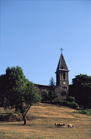 Historic building near Millau, Aveyron, Occitanie, France, with pastures at summerの写真素材